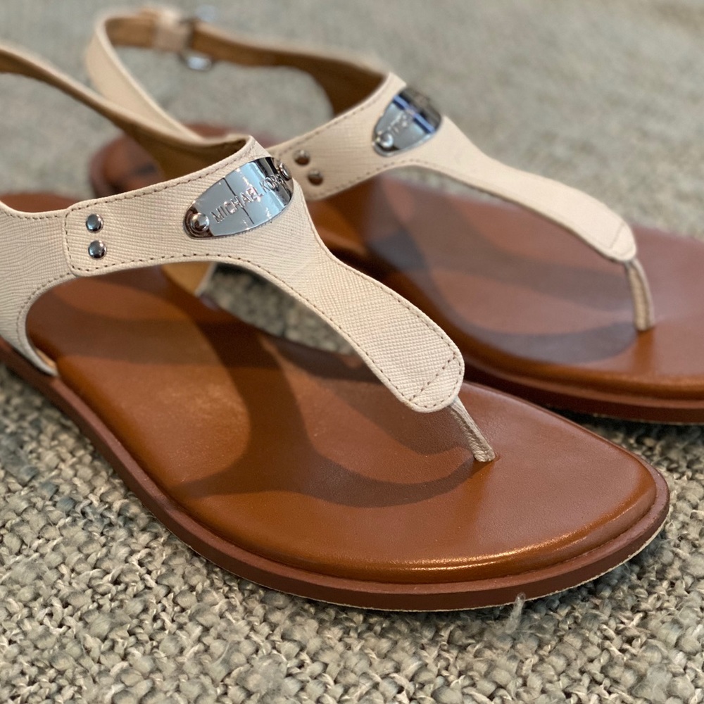 Michael Kors white sandal flats.